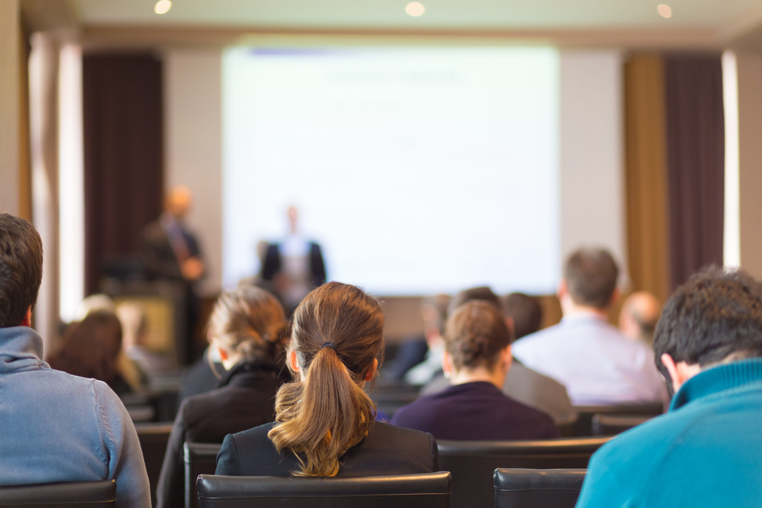 Speaker,At,Business,Conference,And,Presentation.,Audience,In,The,Conference